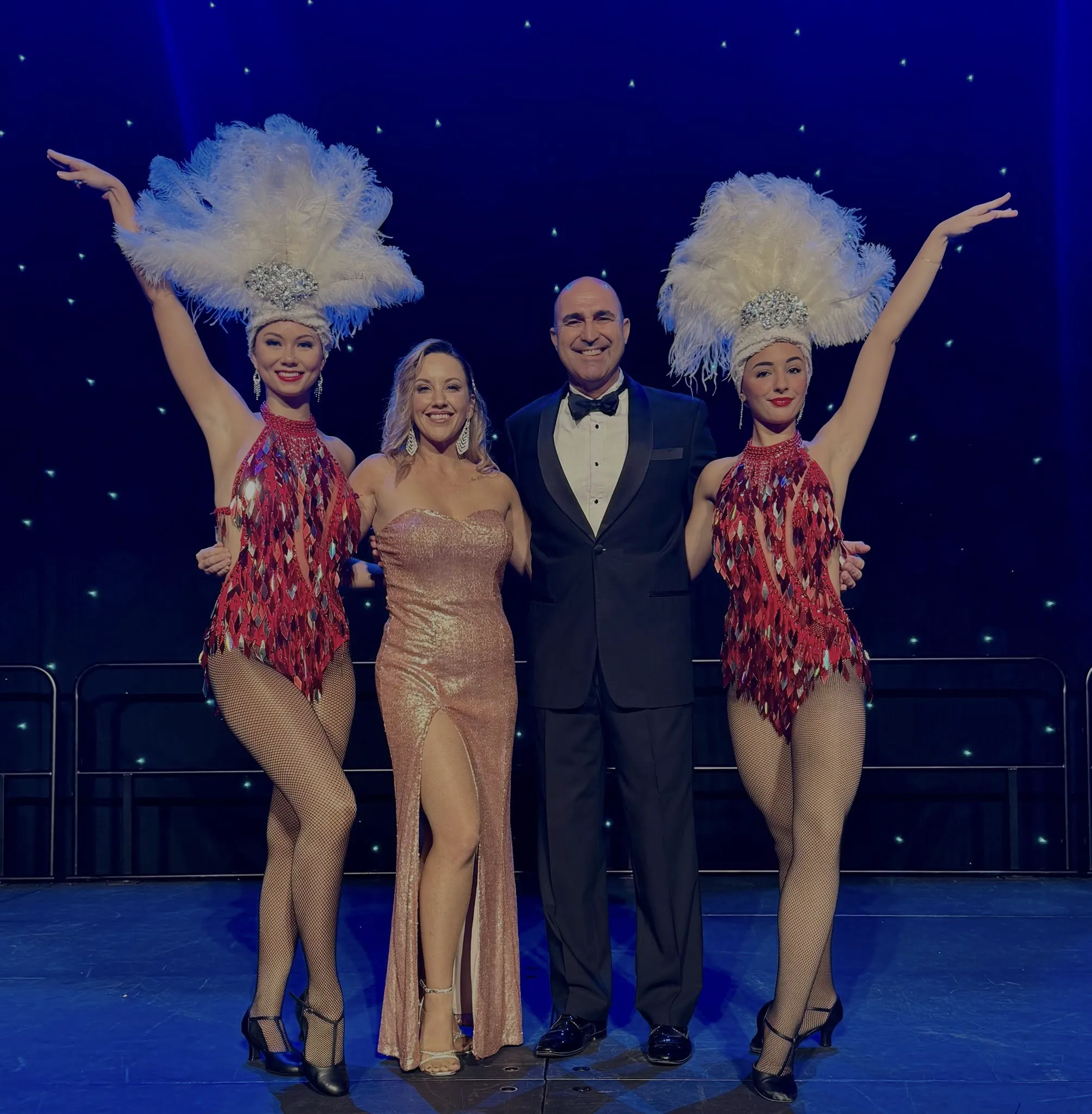 Rick and the troupe on stage